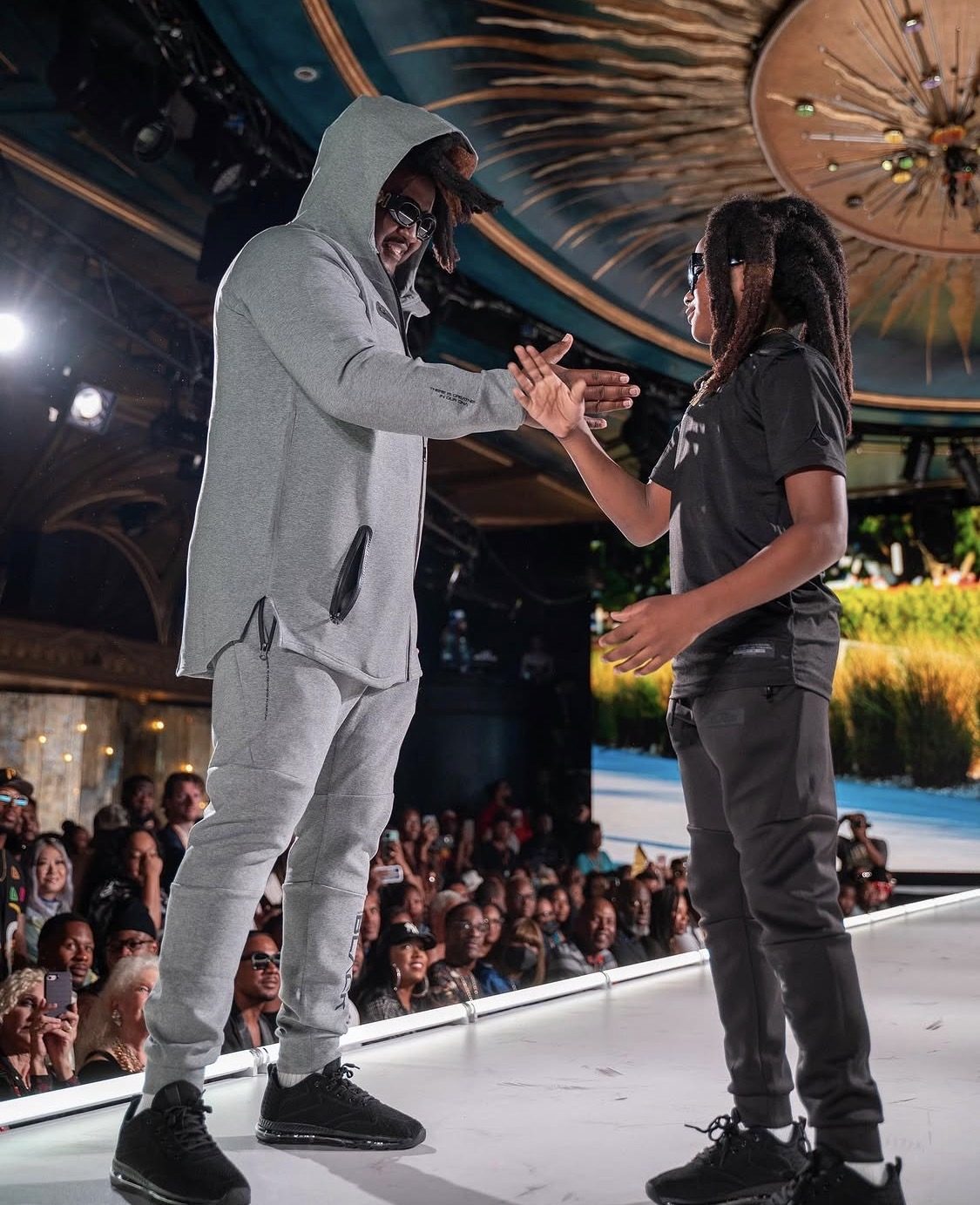 Rudolph Ingram and his son Blaze on stage at New York Fashion Week